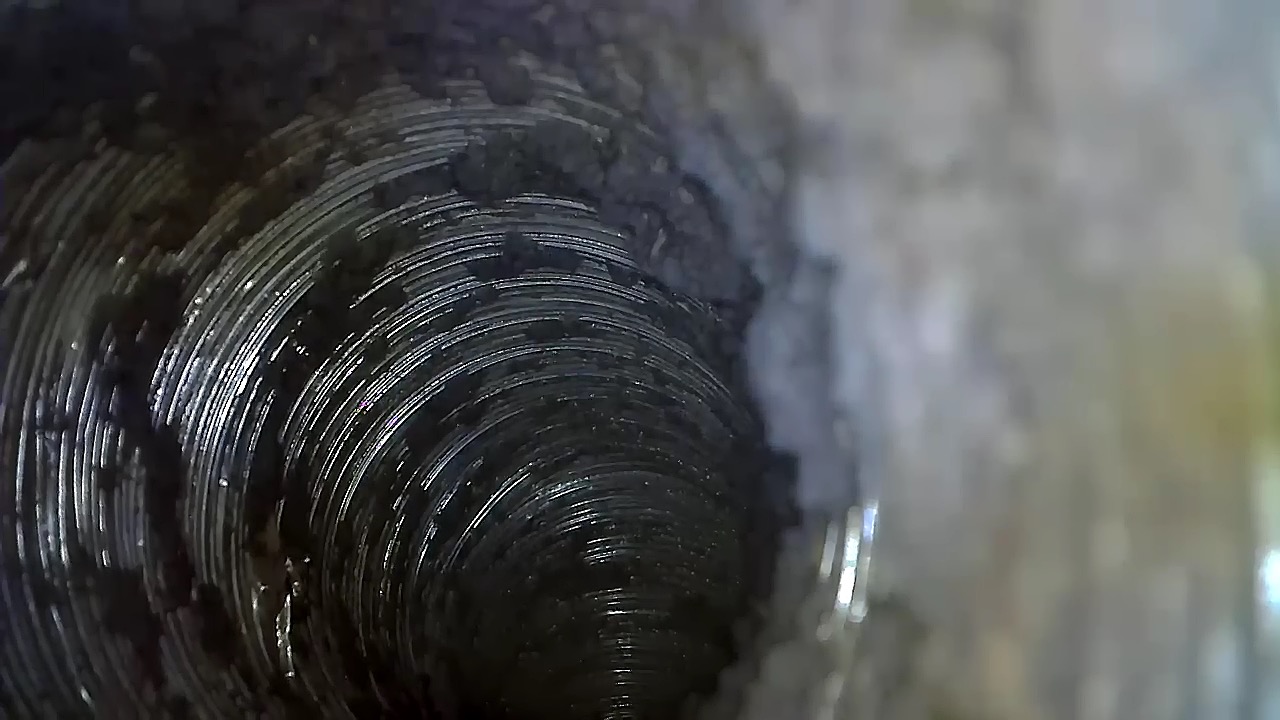 Before — Internal blockage (pre-service) — heavy lint coating restricting airflow