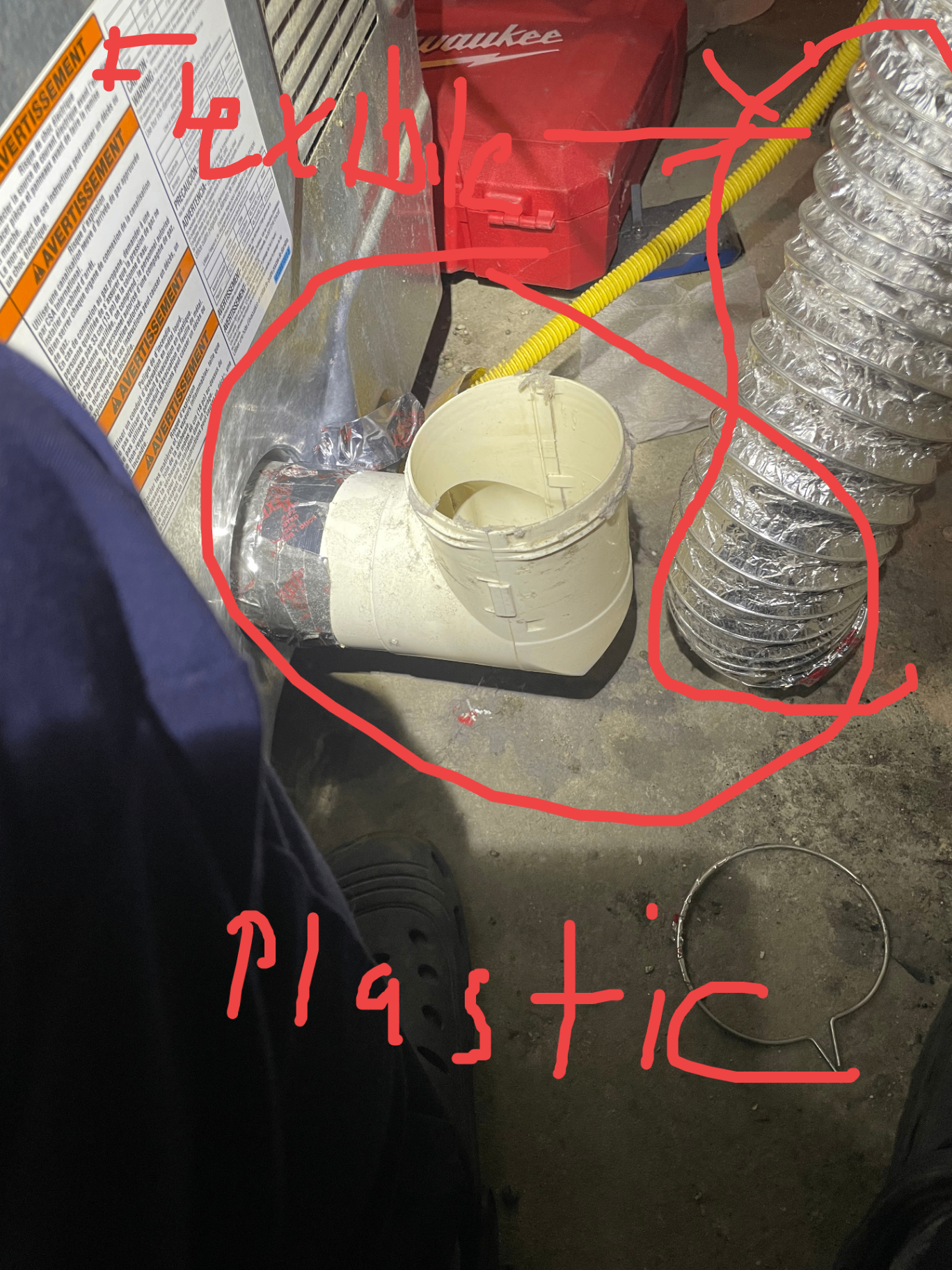 Before — Plastic elbow & flexible foil transition duct — Chicago Building Code 18-28-504.9.3 violation
